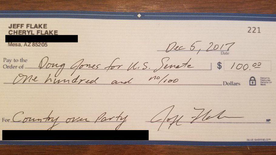 Republican Sen. Jeff Flake sends $100 check to Roy Moore's Democratic opponent
